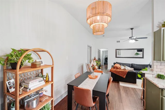 a living room with furniture a rug and a chandelier