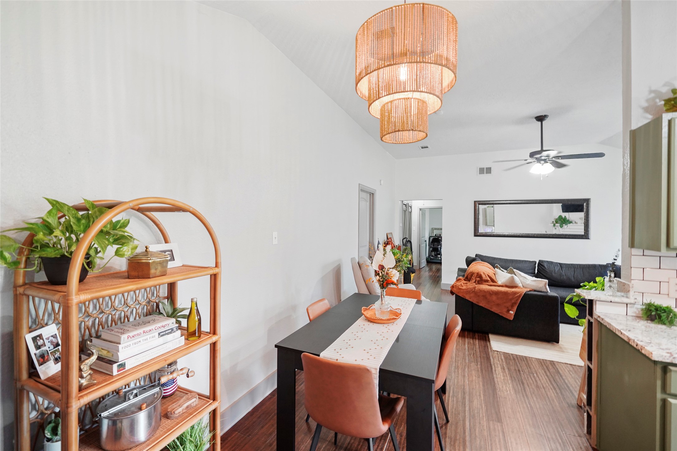 7477 Hidden Acres Drive Cleveland, TX 77328 - Photo 10 of 31 a living room with furniture a rug and a chandelier