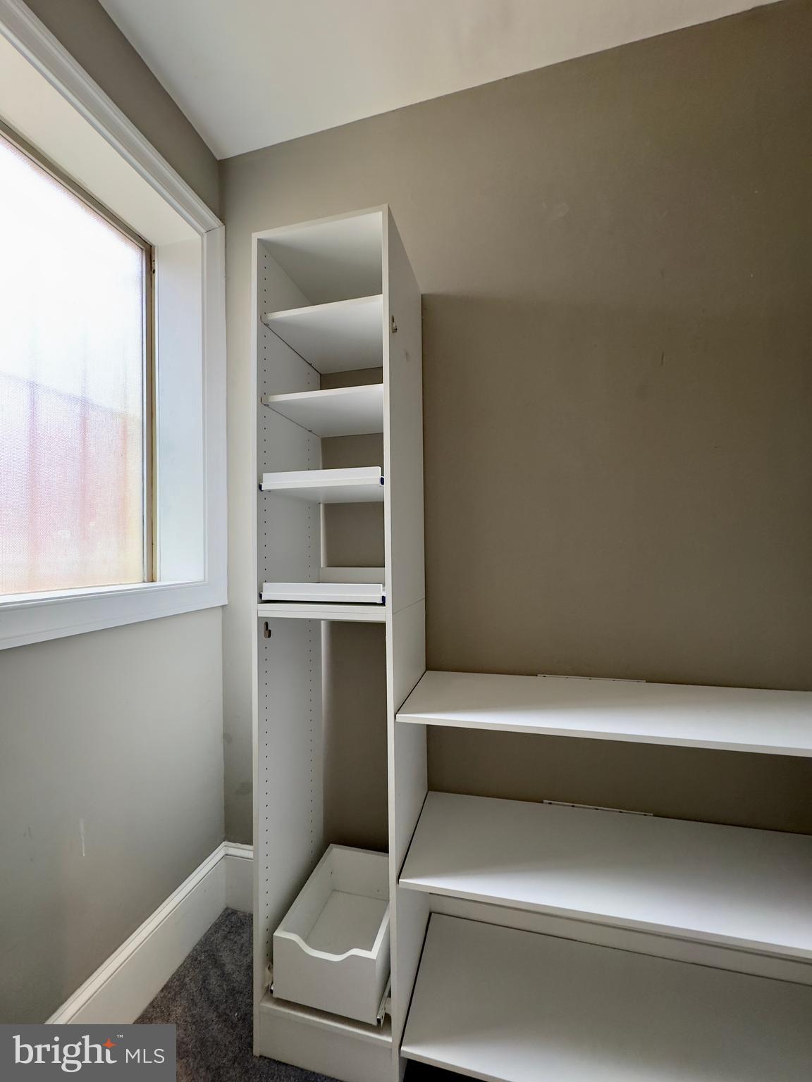 7 West Mulberry Street, Unit 4 Baltimore, MD 21201 - Photo 17 of 19 a bathroom with a toilet and a window