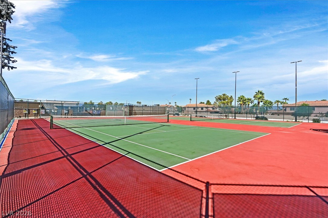 8830 Haviland Road Las Vegas, NV 89123 - Photo 36 of 43 Professional-grade outdoor tennis courts feature durable hard court surfaces under expansive blue skies.