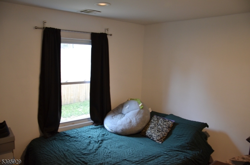 5 West Fairview Avenue Mine Hill, NJ 07803 - Photo 13 of 14 a bed sitting in a room next to a window