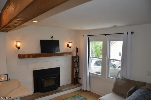 a living room with furniture and flat screen tv