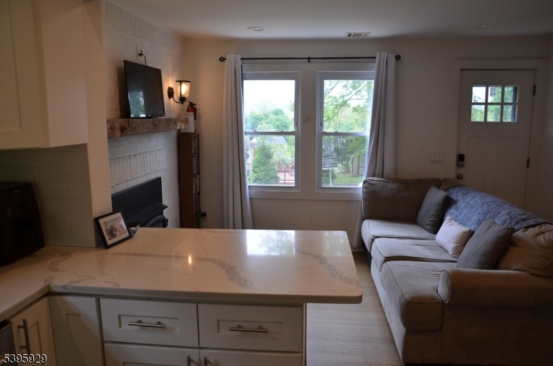 5 West Fairview Avenue Mine Hill, NJ 07803 - Photo 7 of 14 a living room with furniture and flat screen tv