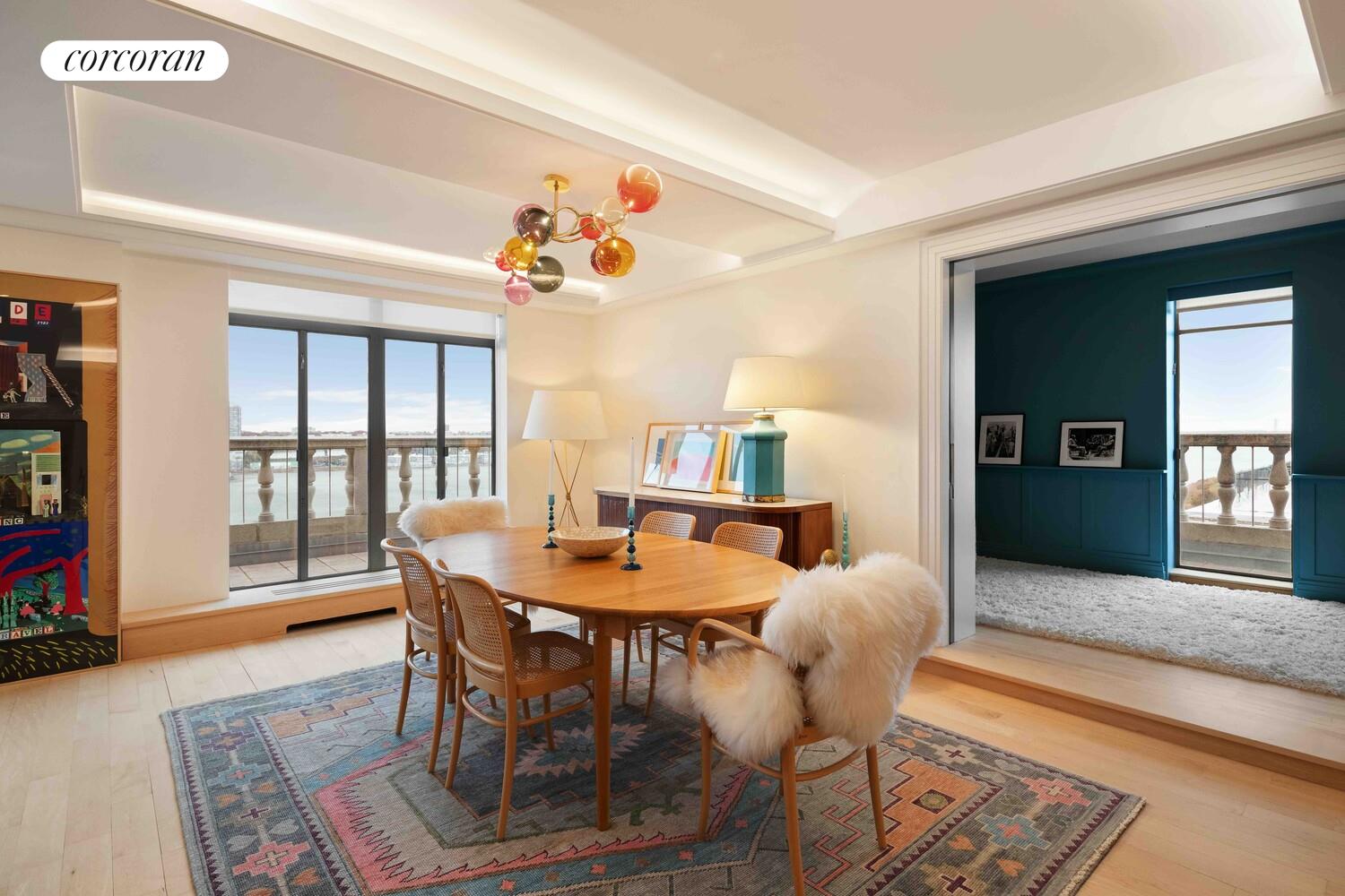 140 Riverside Drive, Unit 19HO Manhattan, NY 10024 - Photo 19 of 35 a view of a dining room with furniture window and wooden floor