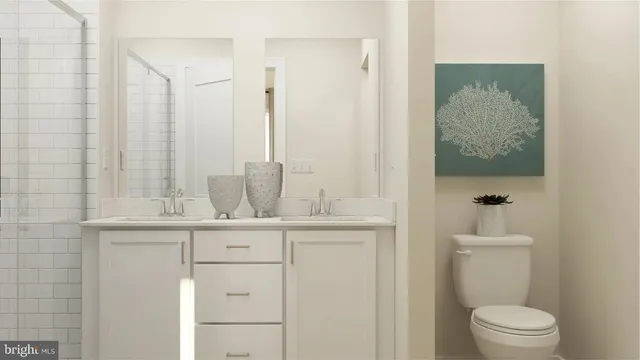 a bathroom with a sink a toilet and mirror