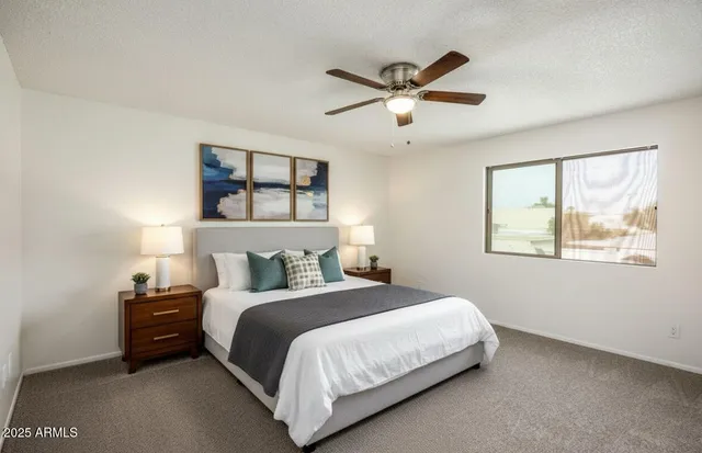 a bedroom with a bed and window