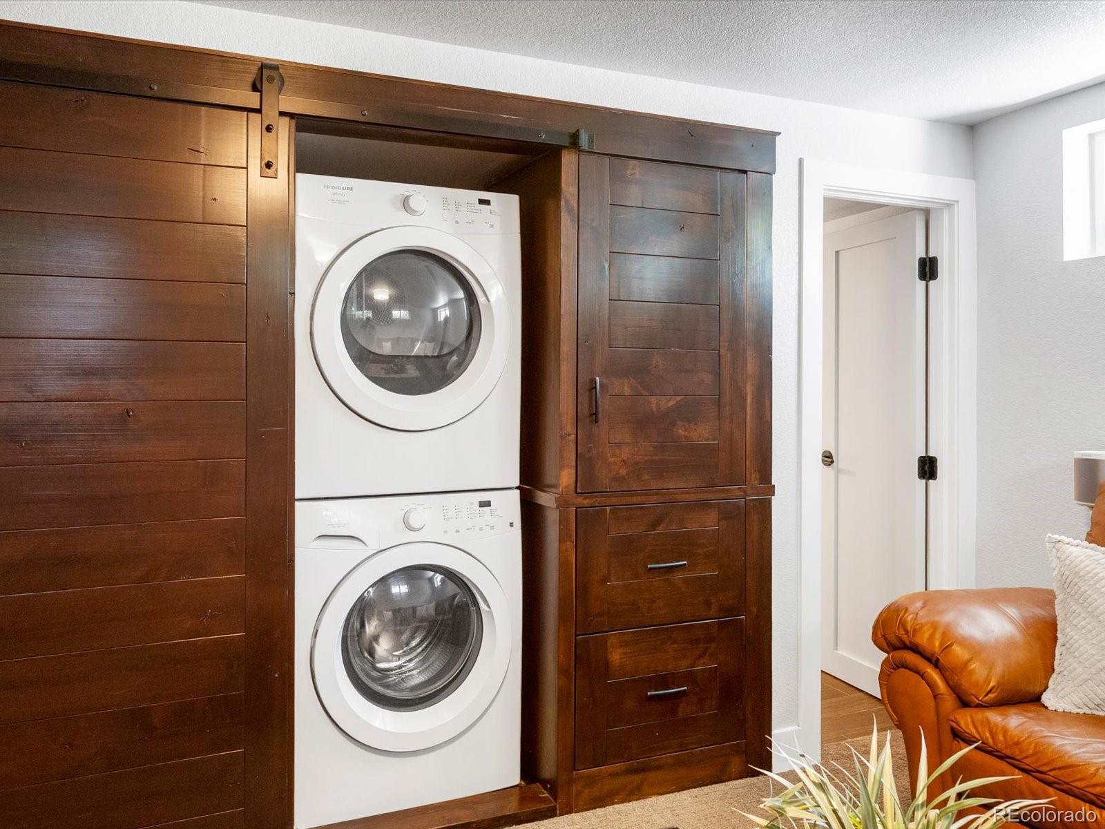 2289 Hudson Street Denver, CO 80207 - Photo 25 of 44 a utility room with dryer and washer
