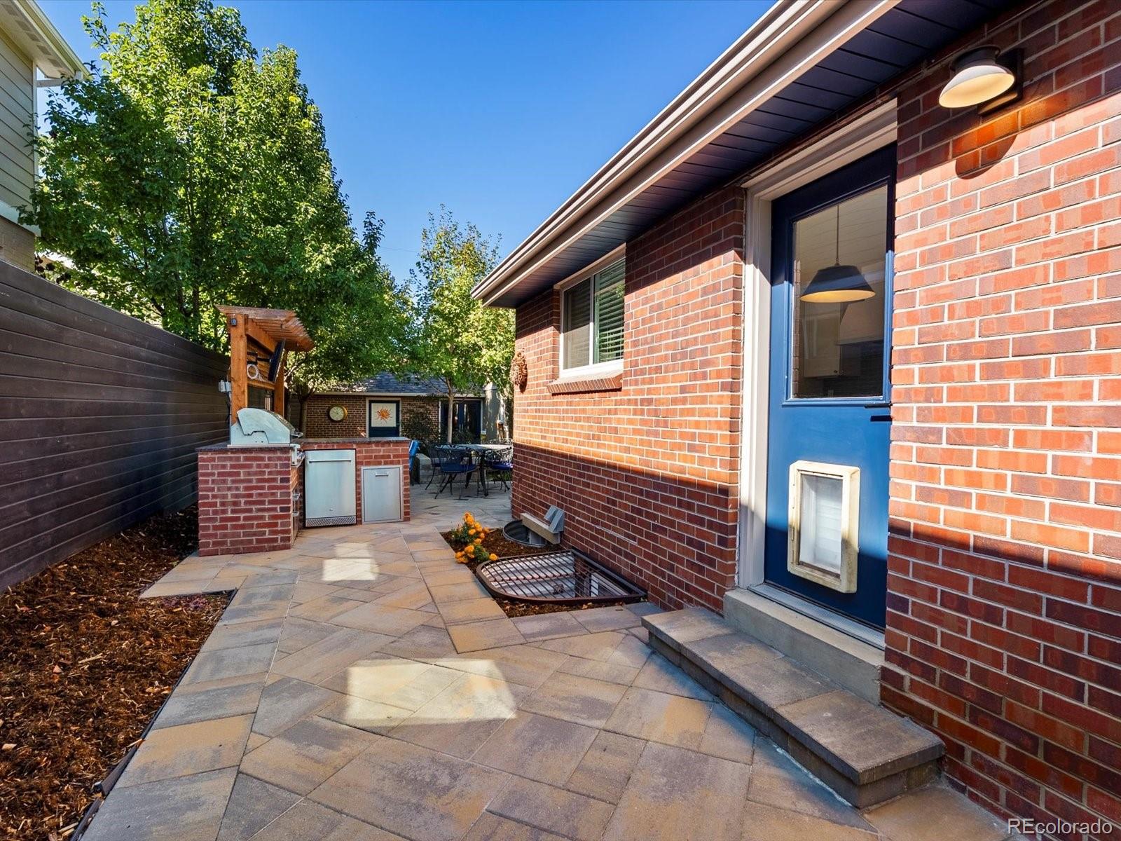 2289 Hudson Street Denver, CO 80207 - Photo 28 of 44 a backyard of a house with seating space