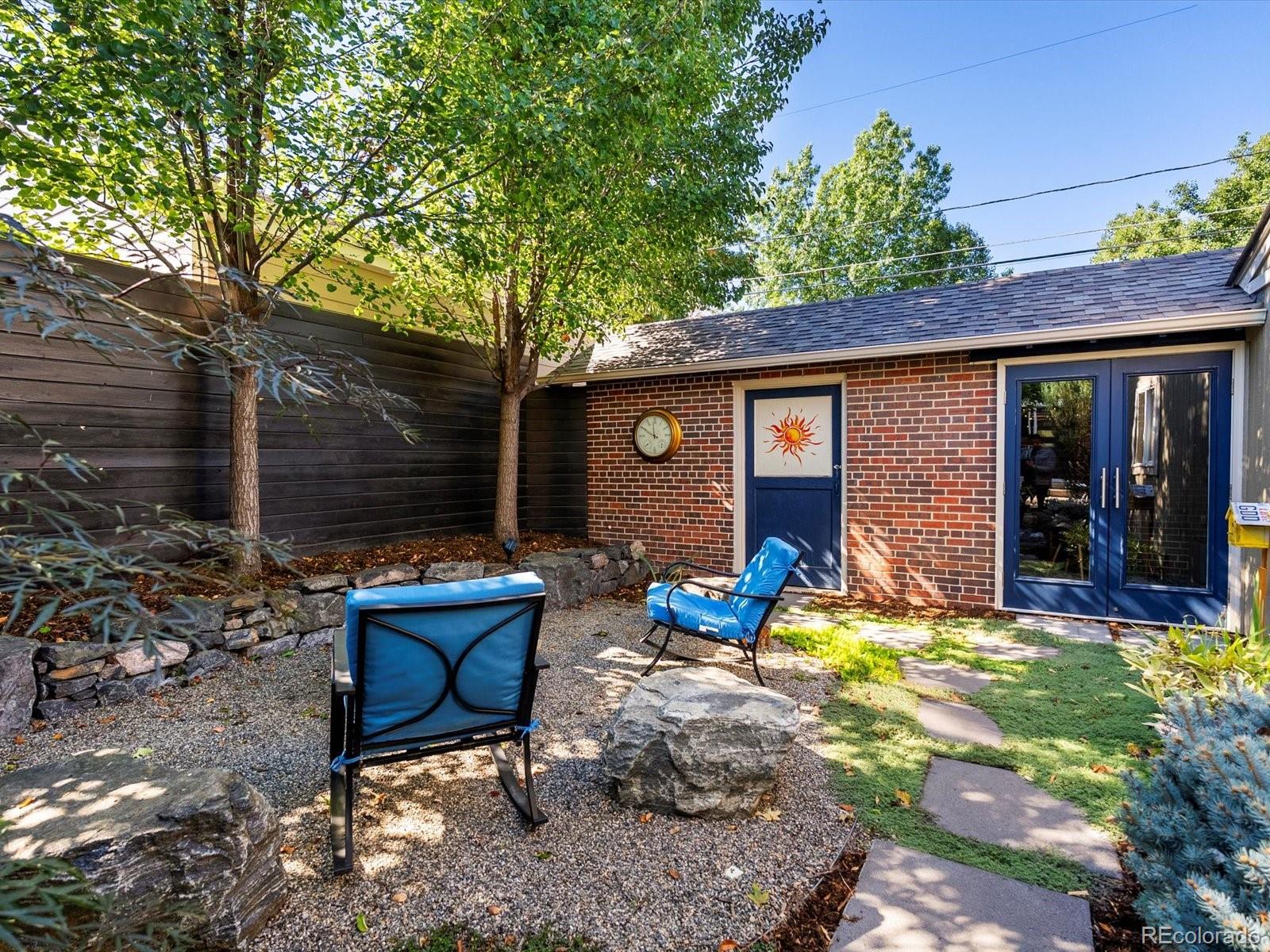2289 Hudson Street Denver, CO 80207 - Photo 34 of 44 a front view of a house with patio