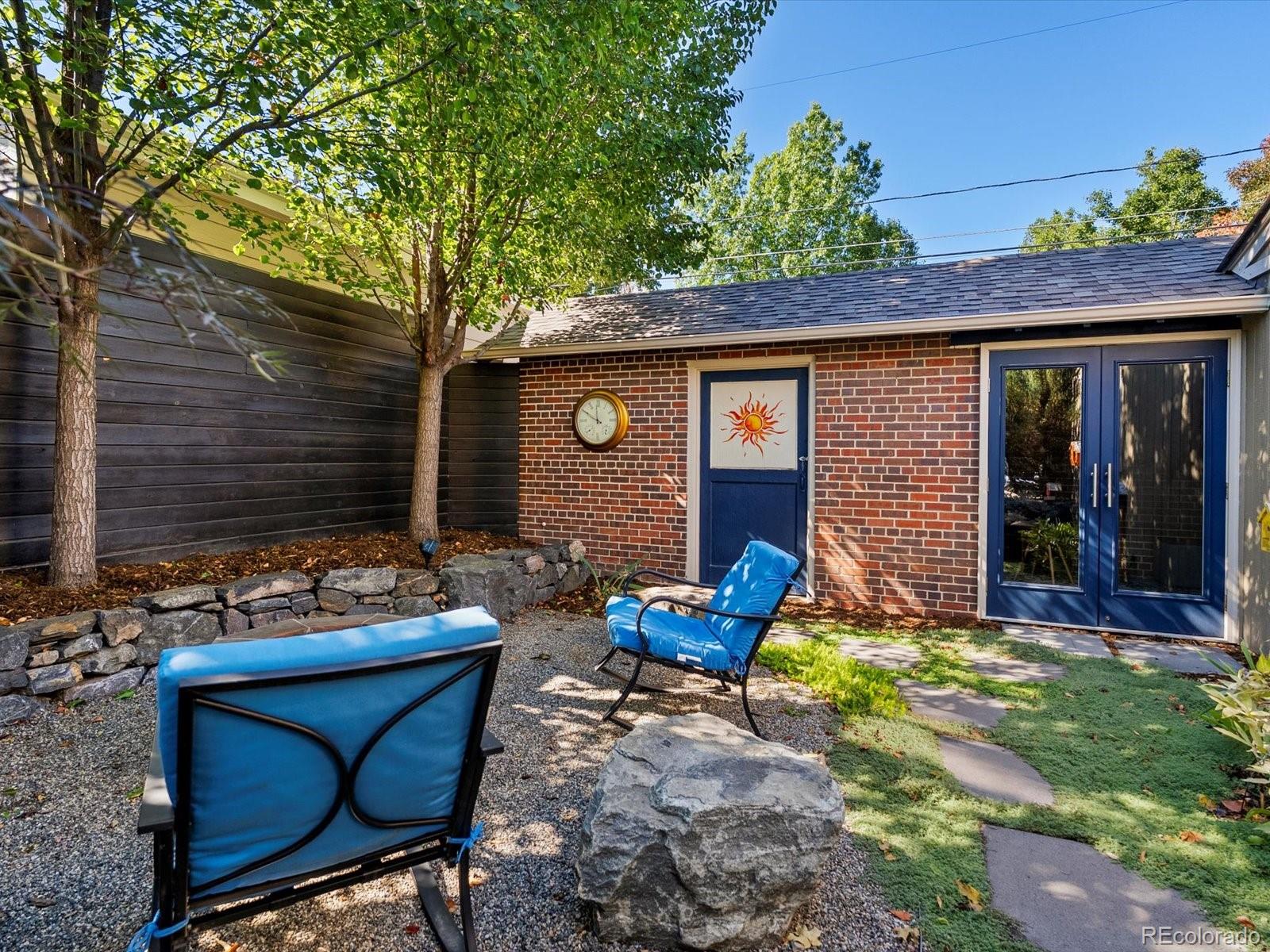 2289 Hudson Street Denver, CO 80207 - Photo 35 of 44 a backyard of a house with seating space