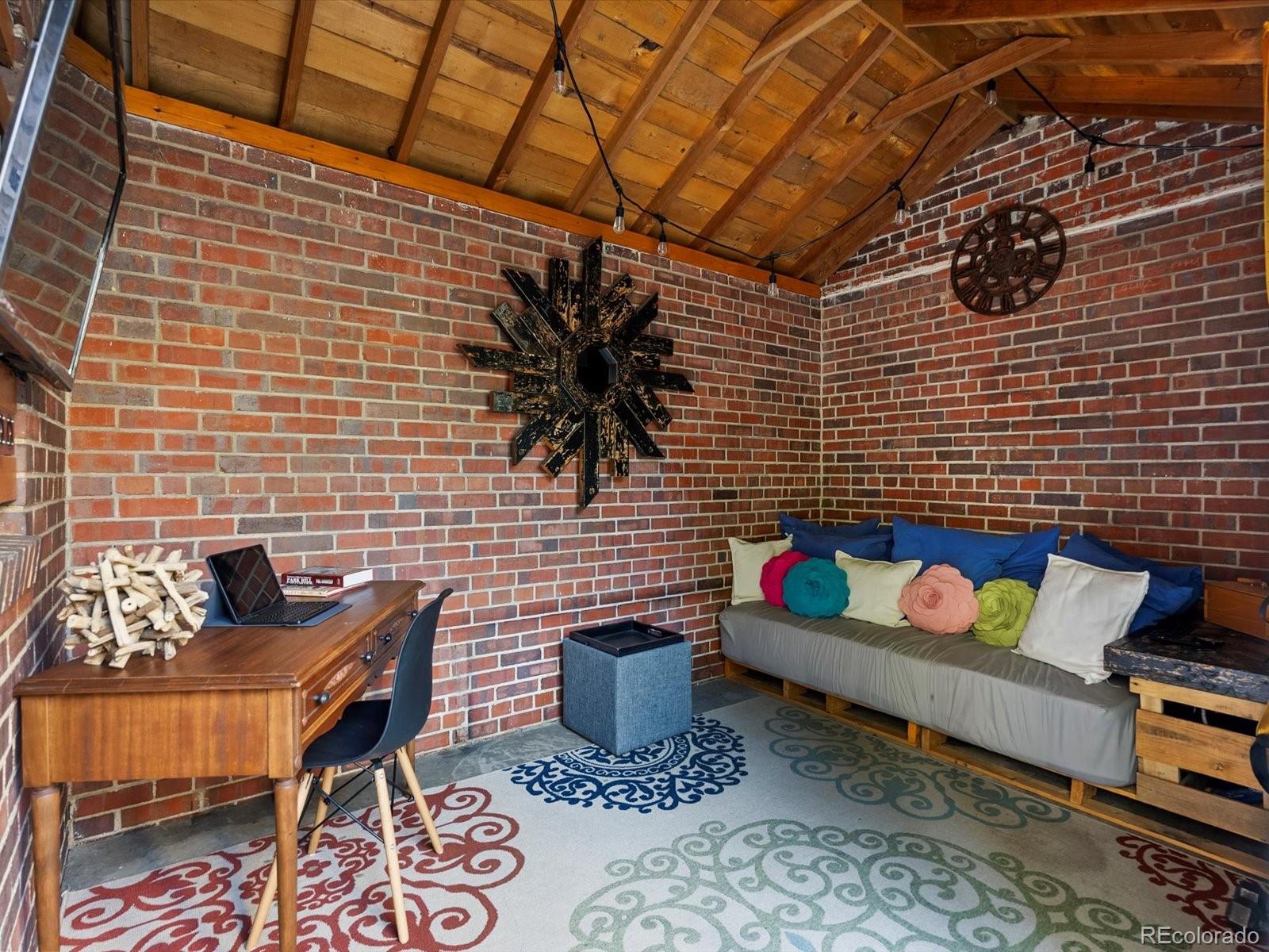 2289 Hudson Street Denver, CO 80207 - Photo 39 of 44 a building outdoor space with patio furniture