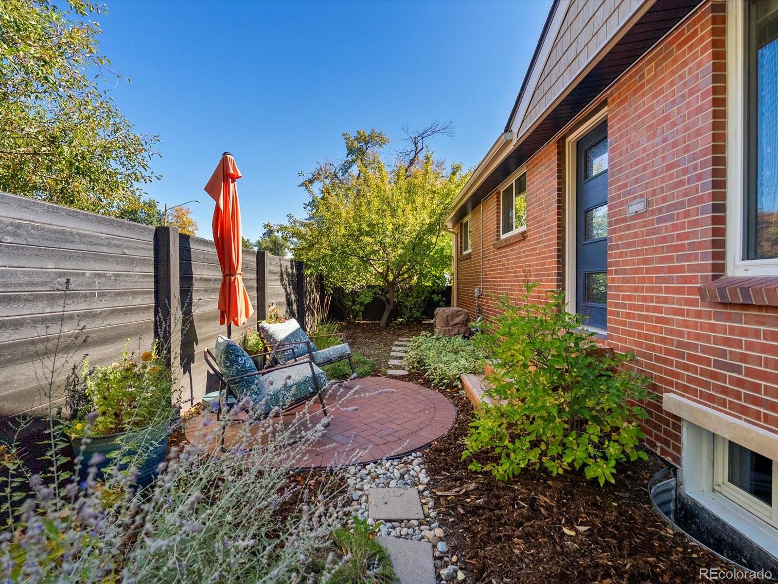 2289 Hudson Street Denver, CO 80207 - Photo 43 of 44 a view of a backyard with potted plants