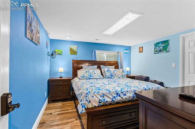 807 Fontmore Road Colorado Springs, CO 80904 - Photo 47 of 50 Bedroom with light hardwood / wood-style floors