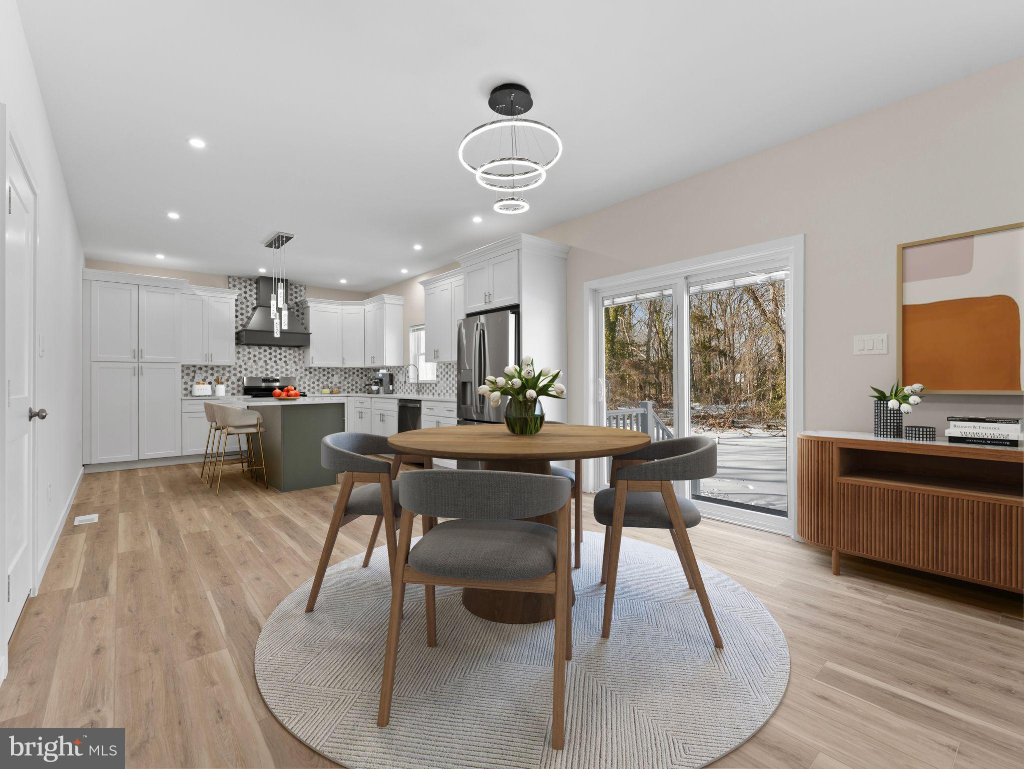 1795 Coles Mill Road Franklinville, NJ 08322 - Photo 11 of 57 a view of a dining room with furniture a chandelier and wooden floor