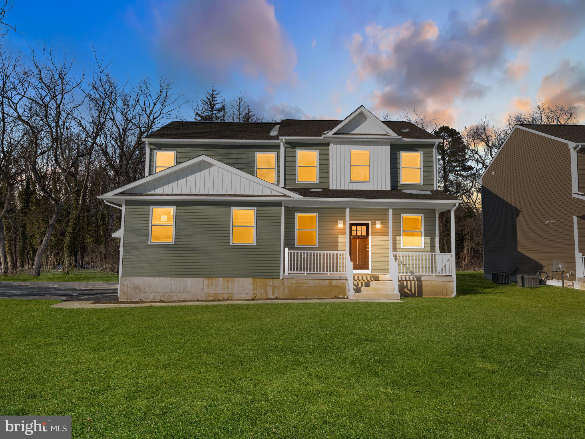 1795 Coles Mill Road Franklinville, NJ 08322 - Photo 2 of 57 a front view of a house with a yard