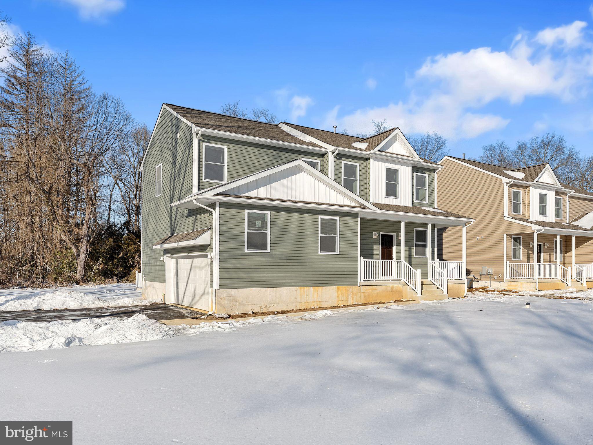 1795 Coles Mill Road Franklinville, NJ 08322 - Photo 6 of 57 a front view of a house with a yard