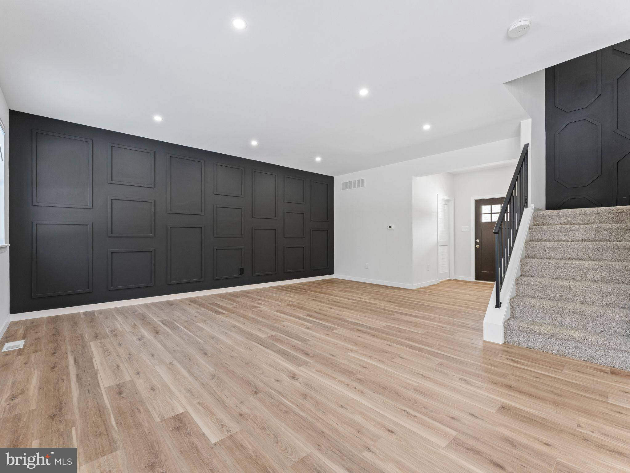 1795 Coles Mill Road Franklinville, NJ 08322 - Photo 10 of 57 a view of an empty room with wooden floor and a ceiling fan