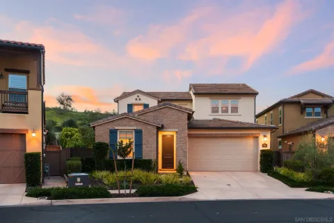 an aerial view of a house with a yard basket ball court and outdoor seating