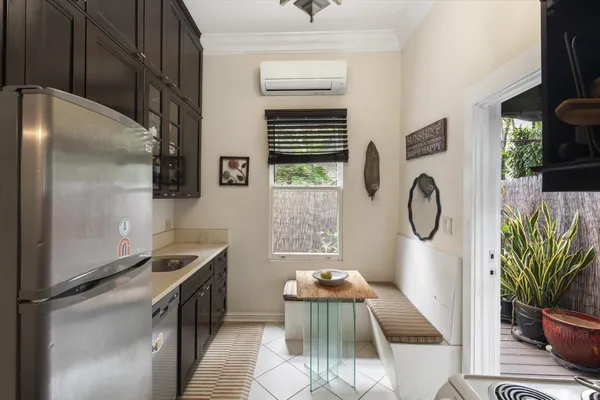 a kitchen with a sink and refrigerator