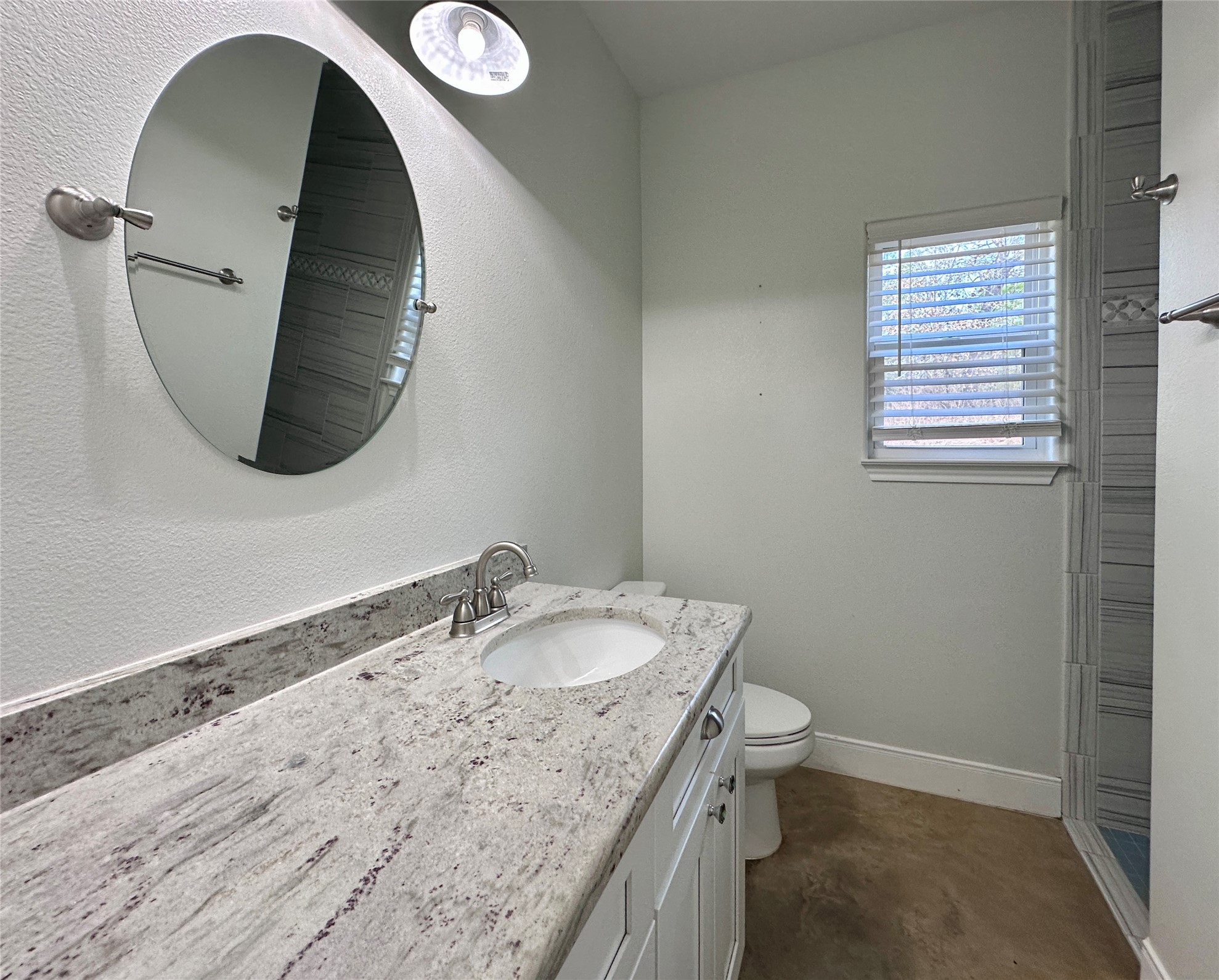 124 Pine Path Bastrop, TX 78602 - Photo 16 of 31 Spare Bathroom with toilet, vanity, and walk-in shower