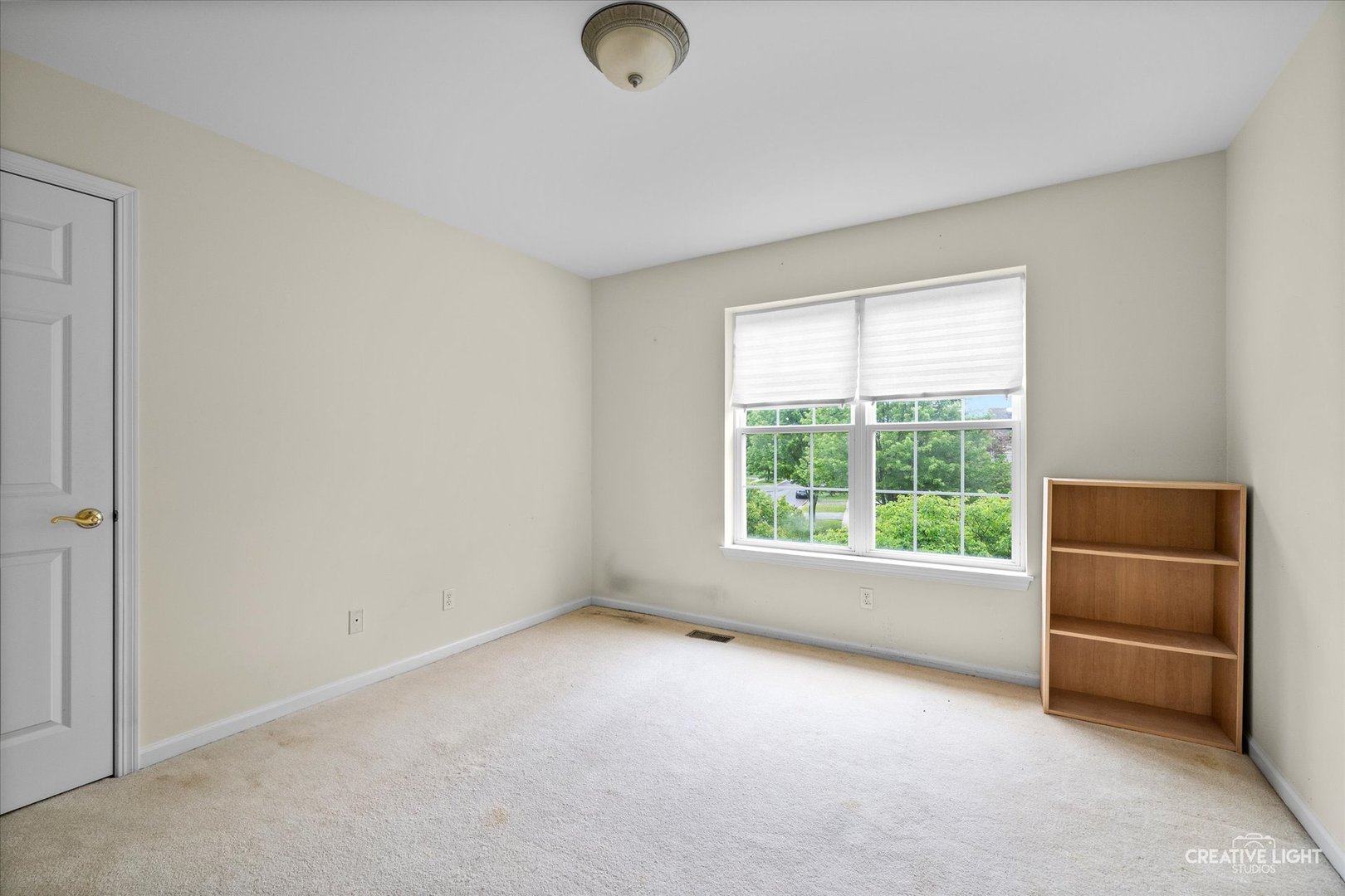 S970 Newton Square Geneva, IL 60134 - Photo 13 of 35 an empty room with a window