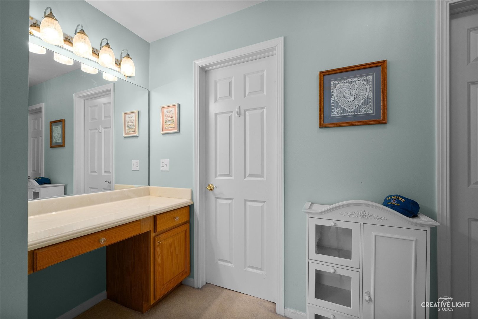 S970 Newton Square Geneva, IL 60134 - Photo 15 of 35 a bathroom with a sink vanity and a mirror