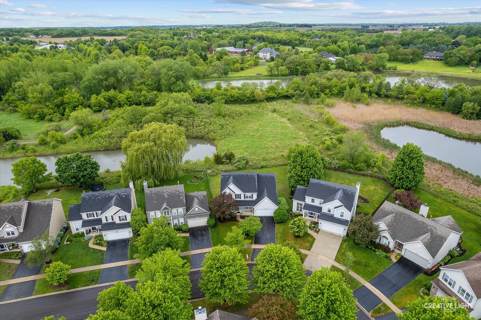S970 Newton Square Geneva, IL 60134 - Photo 20 of 35 an aerial view of a house with garden space and outdoor seating