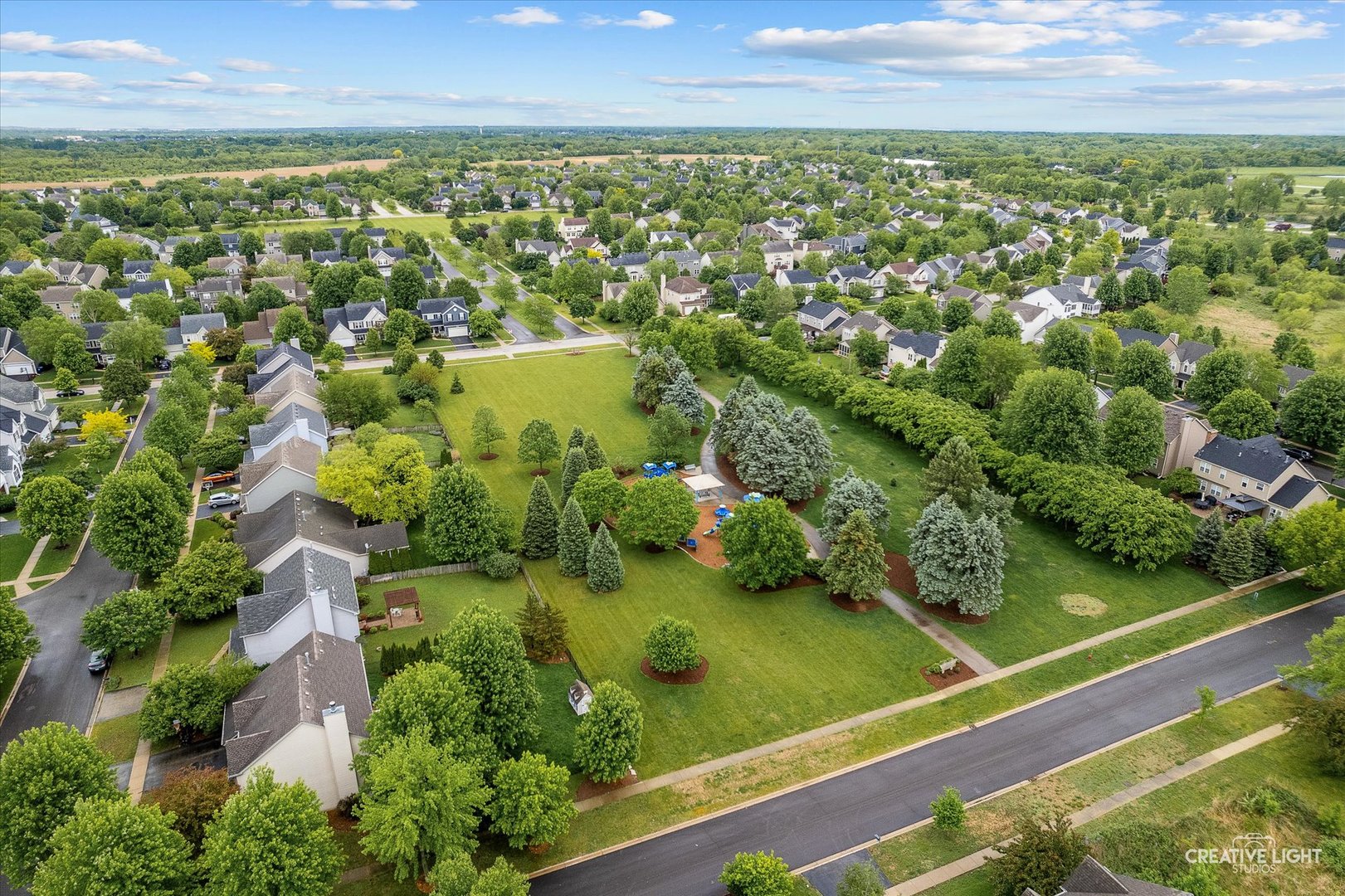 S970 Newton Square Geneva, IL 60134 - Photo 22 of 35 an aerial view of residential houses with outdoor space and trees