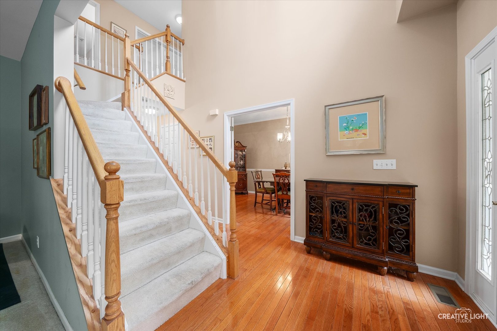 S970 Newton Square Geneva, IL 60134 - Photo 3 of 35 a view of entryway and hall with wooden floor