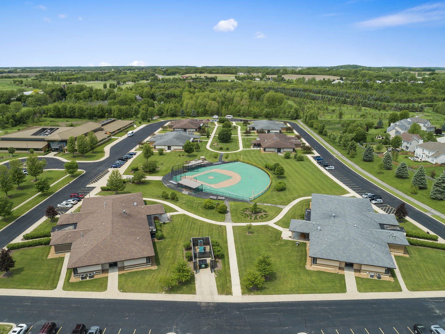 S970 Newton Square Geneva, IL 60134 - Photo 34 of 35 a aerial view of a tennis ground and a big yard