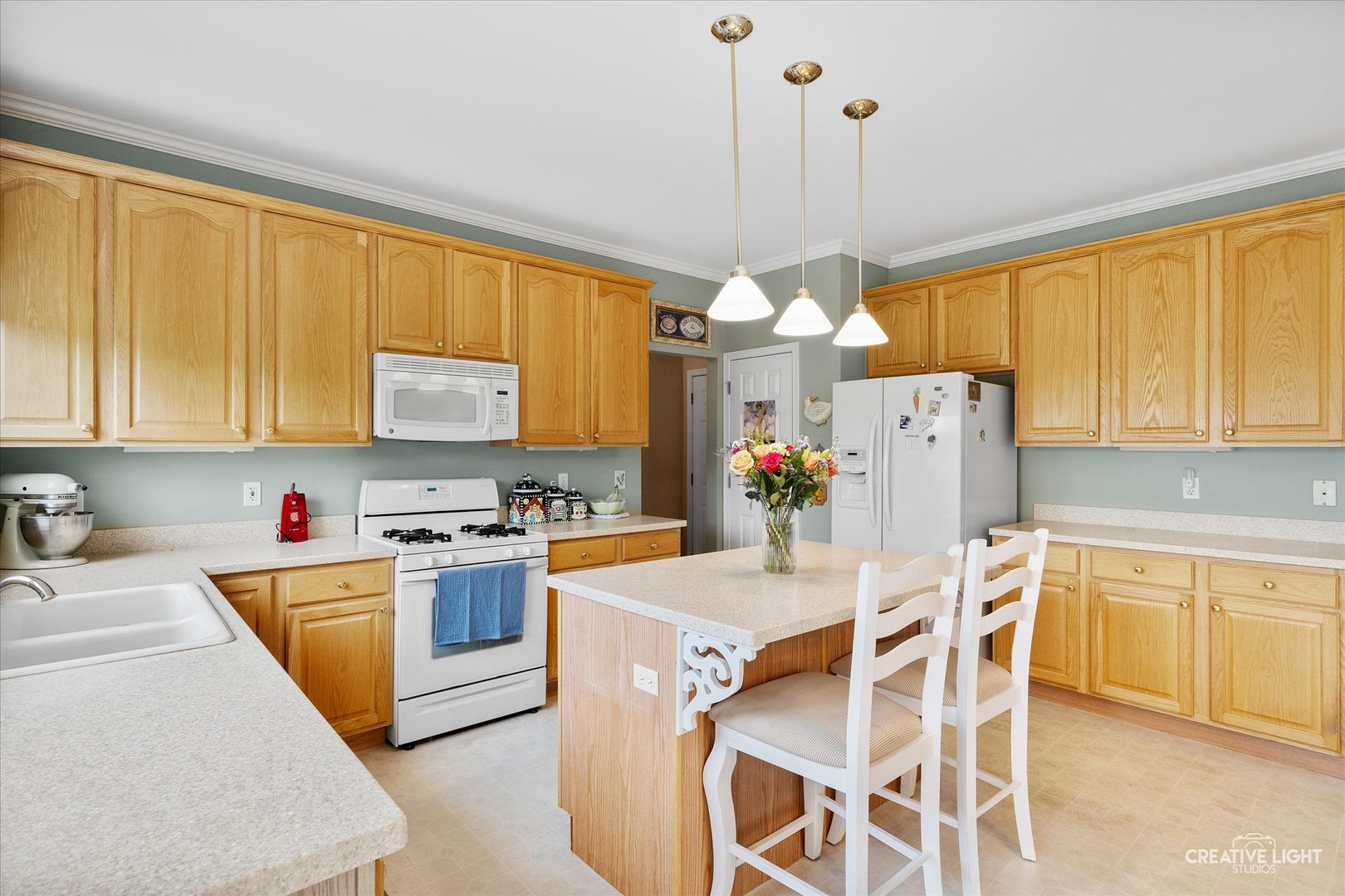 S970 Newton Square Geneva, IL 60134 - Photo 8 of 35 a kitchen that has a lot of cabinets and refrigerator