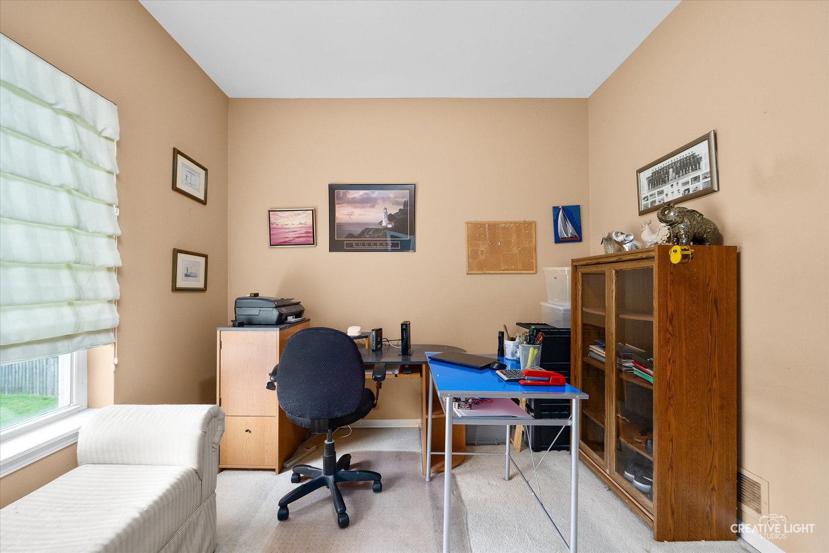 S970 Newton Square Geneva, IL 60134 - Photo 9 of 35 a view of a workspace with furniture and a window