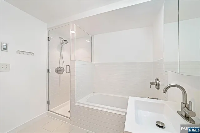 a bathroom with a sink and a shower