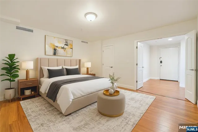 a spacious bedroom with a bed and a couch