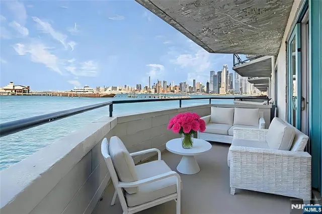 a view of roof deck with furniture