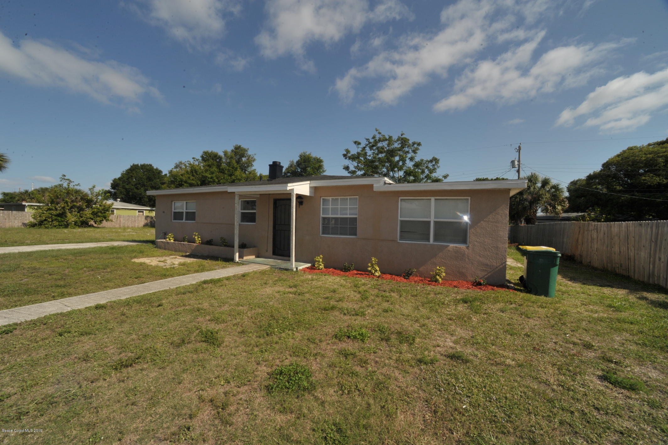 front view of a house with a big yard