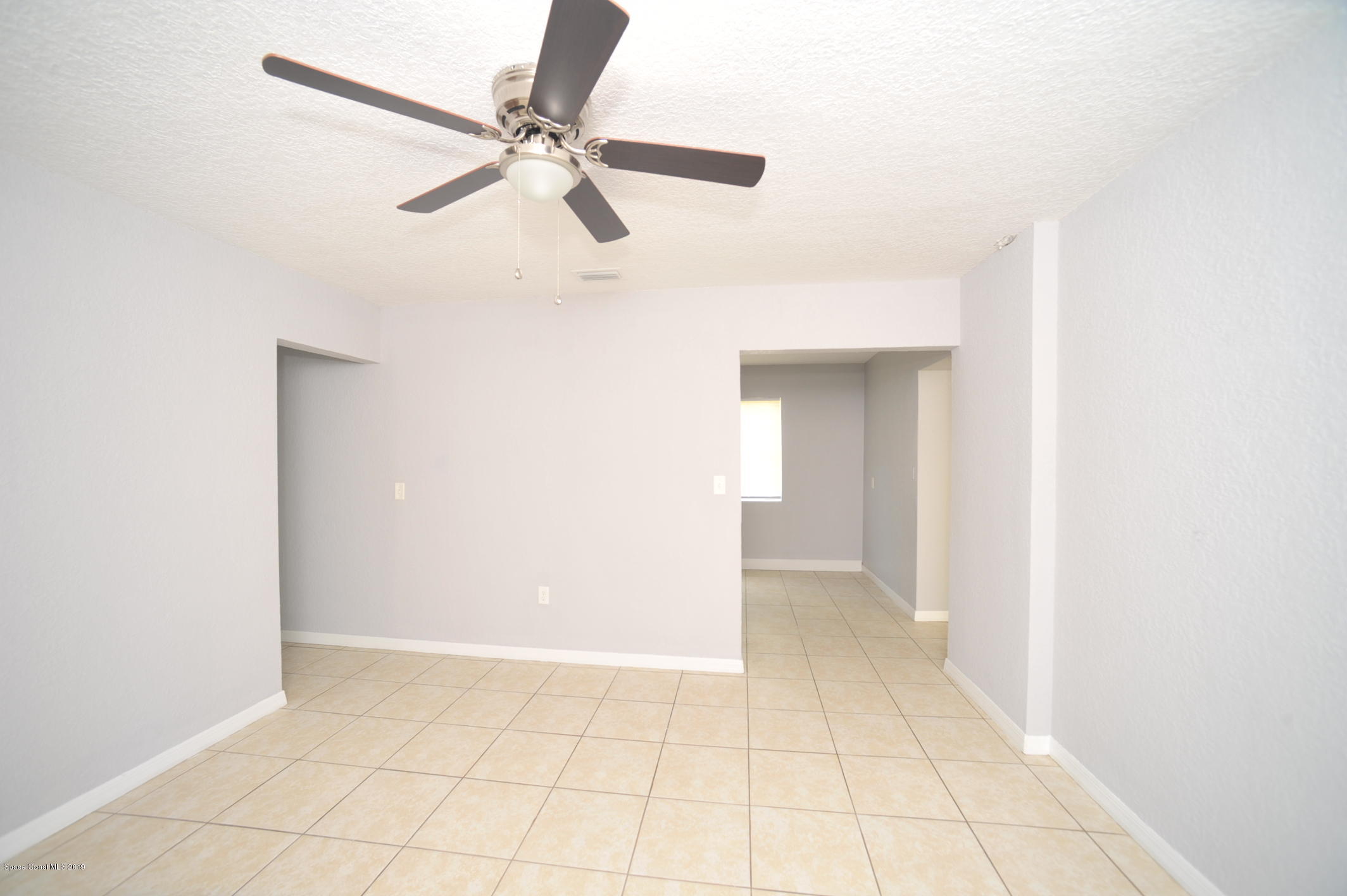 1049 Mitchell Street Cocoa, FL 32922 - Photo 2 of 12 a view of an empty room