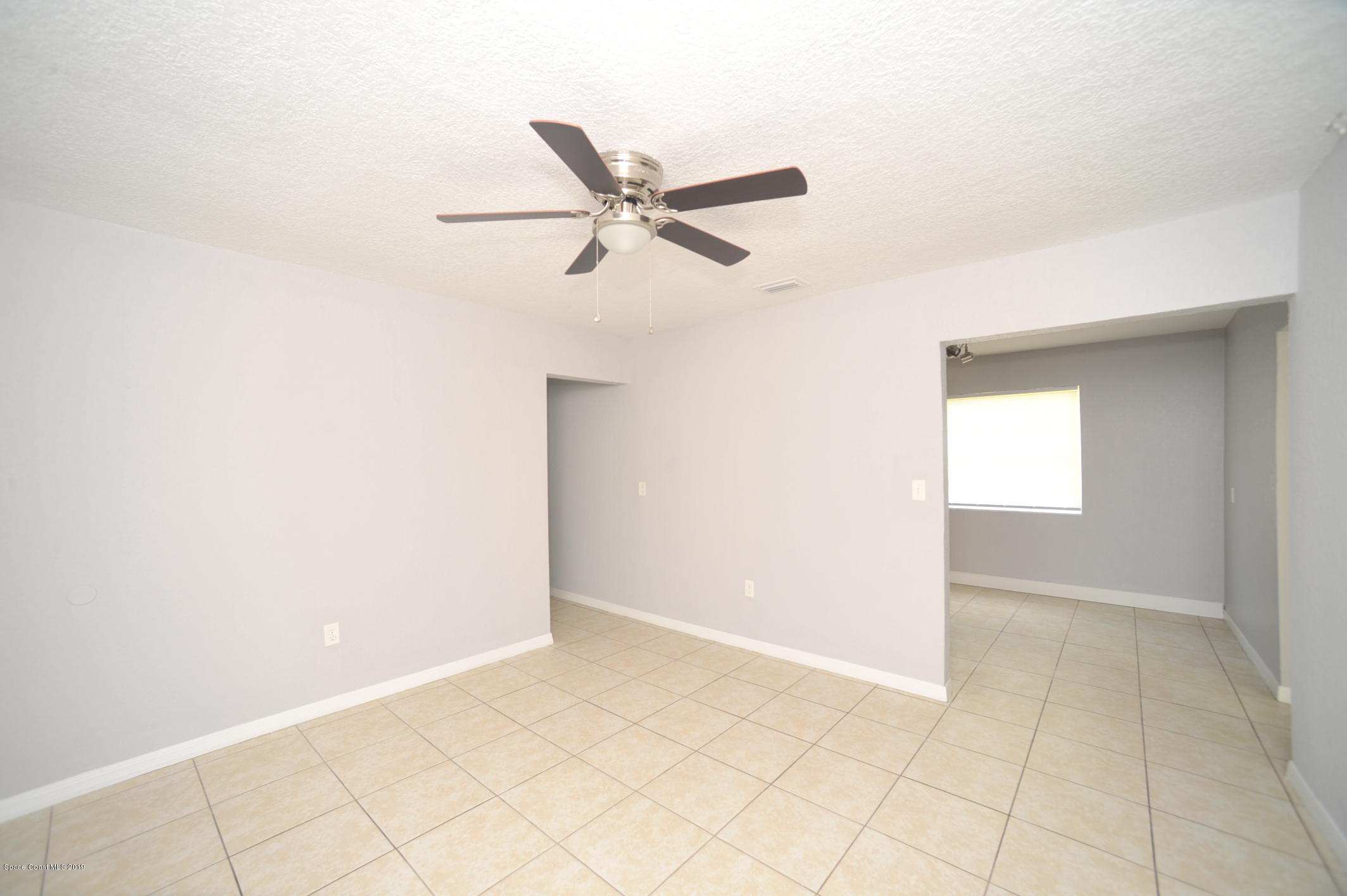1049 Mitchell Street Cocoa, FL 32922 - Photo 3 of 12 a view of an empty room
