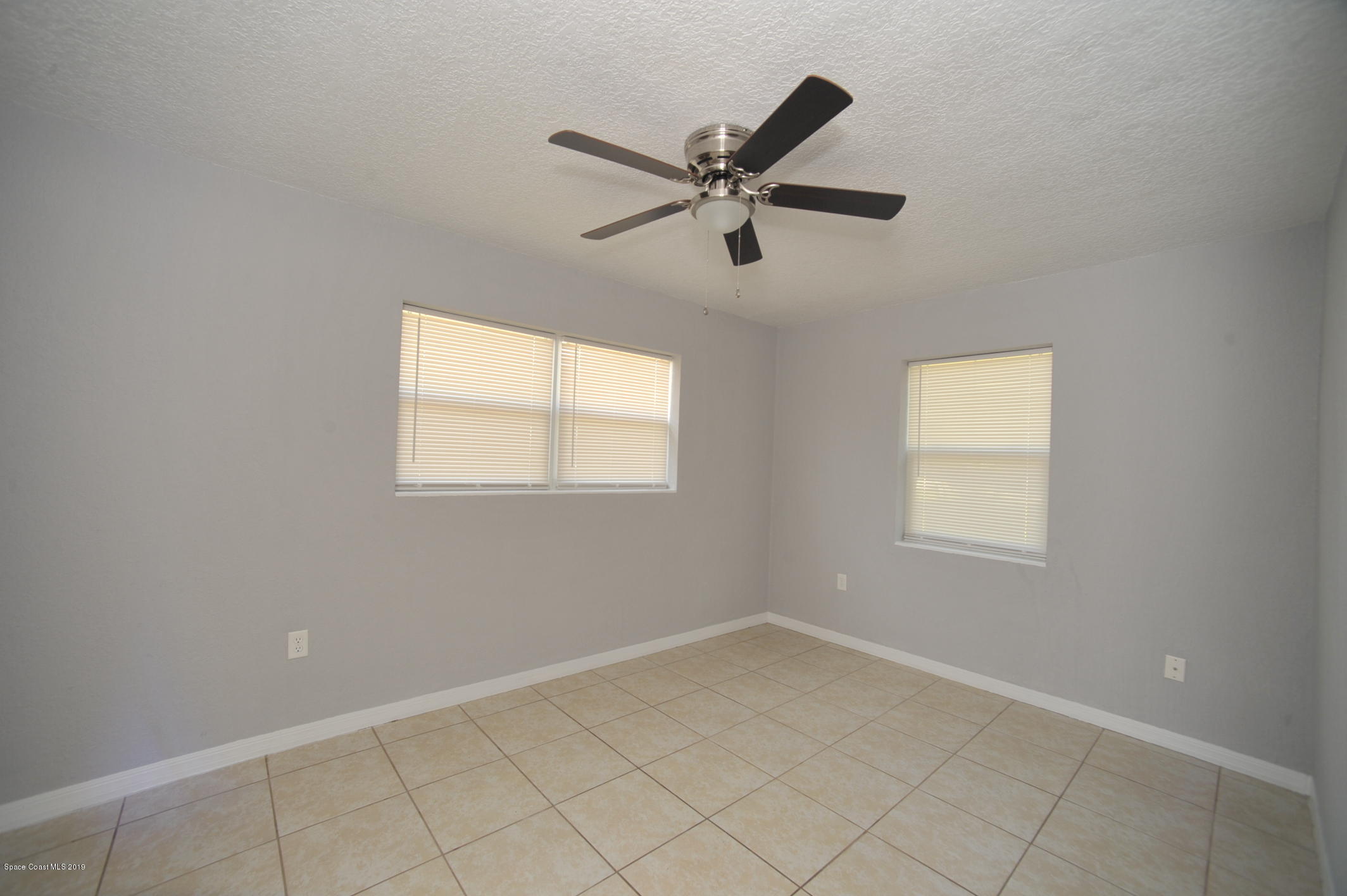 1049 Mitchell Street Cocoa, FL 32922 - Photo 7 of 12 a view of a window in an empty room