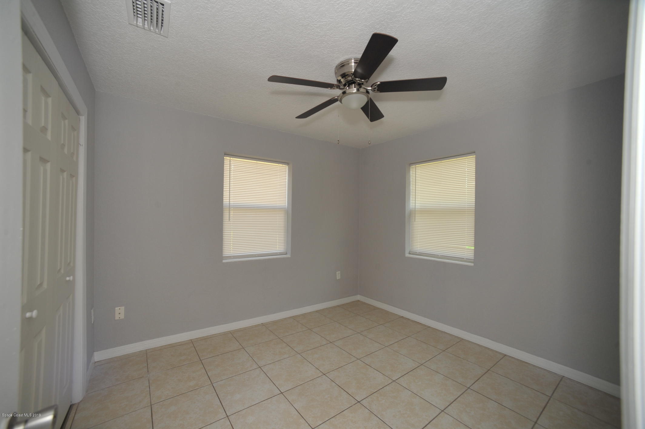 1049 Mitchell Street Cocoa, FL 32922 - Photo 9 of 12 a view of a livingroom with a window