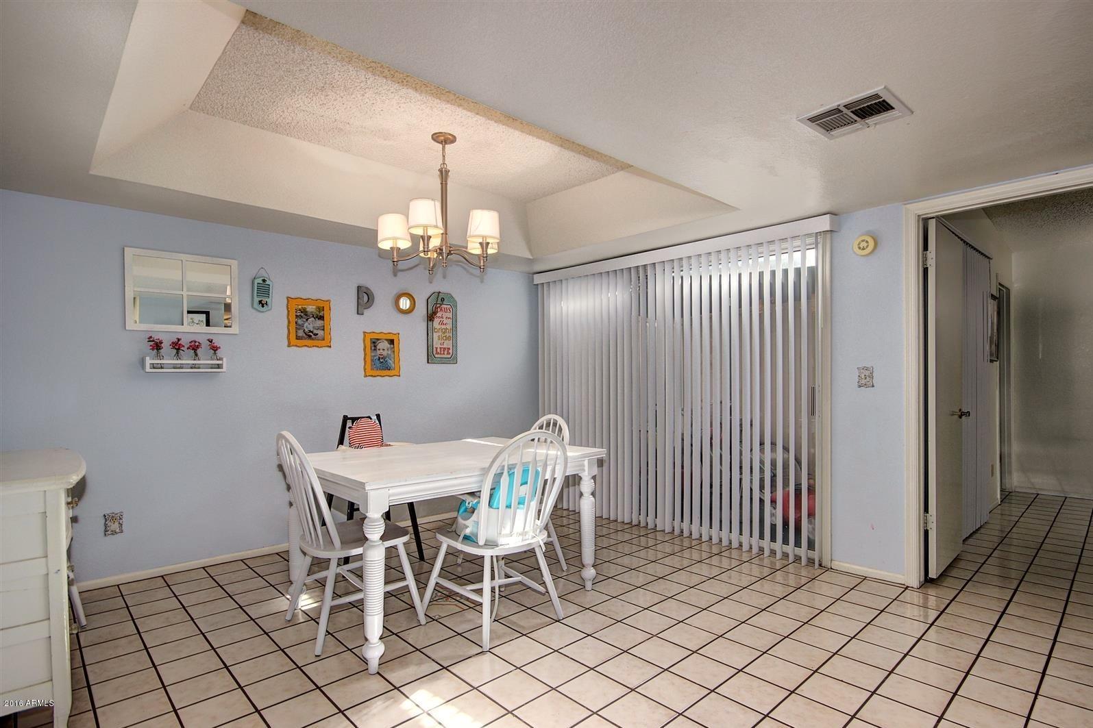 2929 East Broadway Road, Unit 102 Mesa, AZ 85204 - Photo 6 of 16 a view of a dining room with furniture