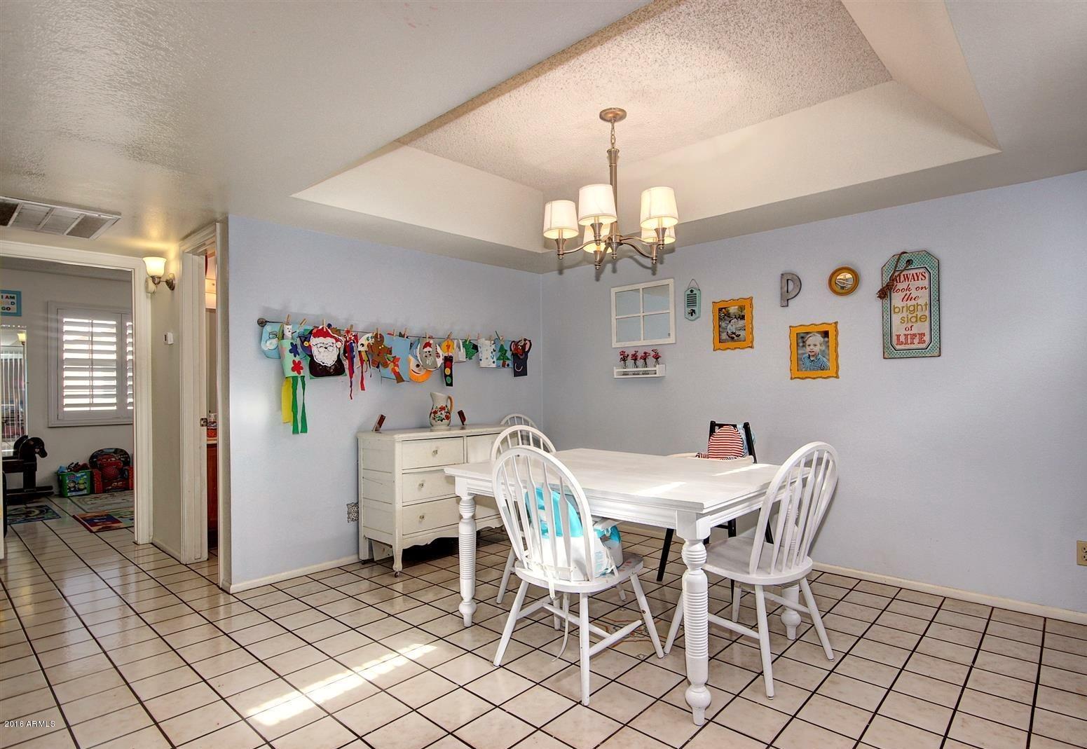 2929 East Broadway Road, Unit 102 Mesa, AZ 85204 - Photo 9 of 16 a view of a dining room with furniture