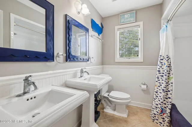 a living room with furniture dining table and a flat screen tv