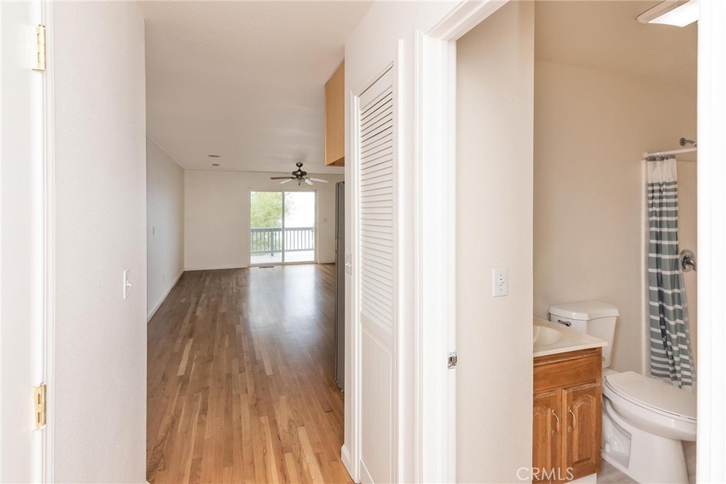 4567 State Highway 20 Nice, CA 95464 - Photo 14 of 58 a view of a hallway with wooden floor and a bathroom