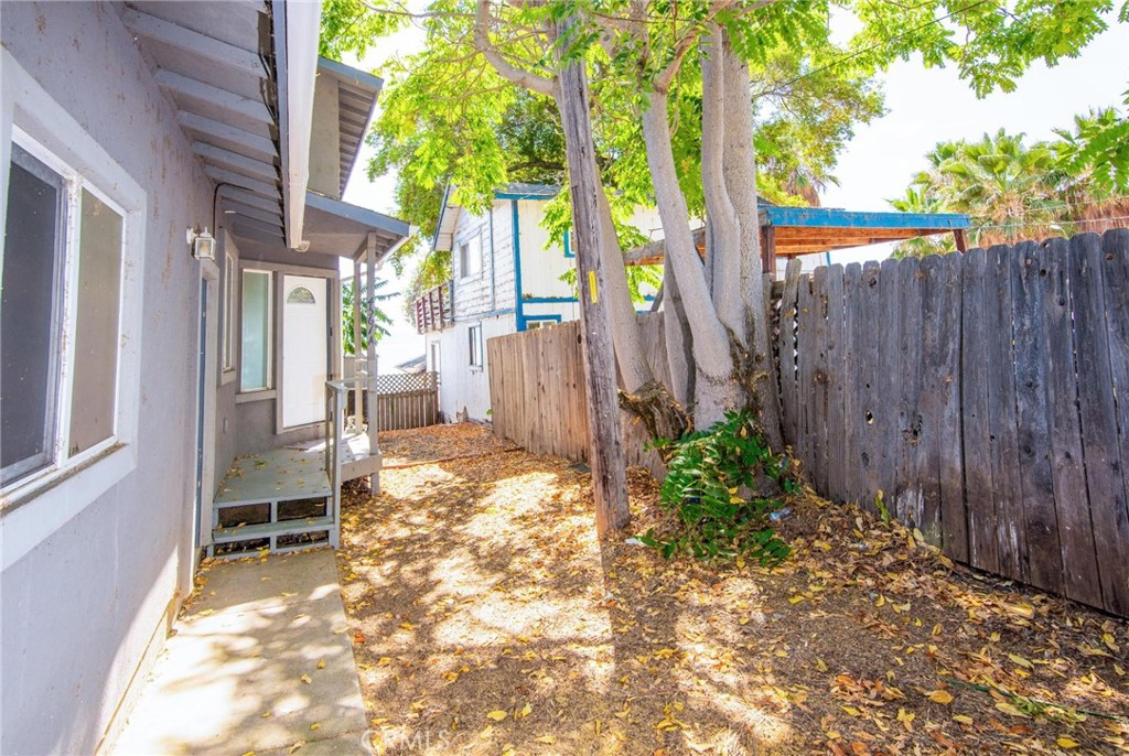 4567 State Highway 20 Nice, CA 95464 - Photo 36 of 58 a view of a backyard with table and chairs and wooden fence