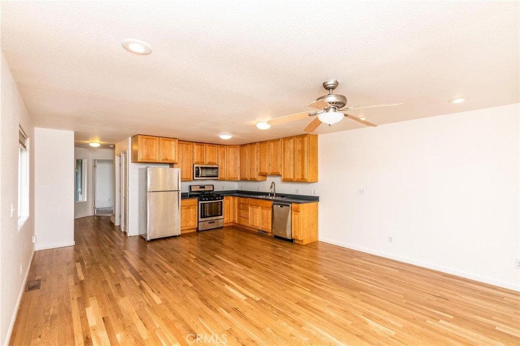 4567 State Highway 20 Nice, CA 95464 - Photo 42 of 58 a kitchen with stainless steel appliances kitchen island wooden floors and granite counter tops
