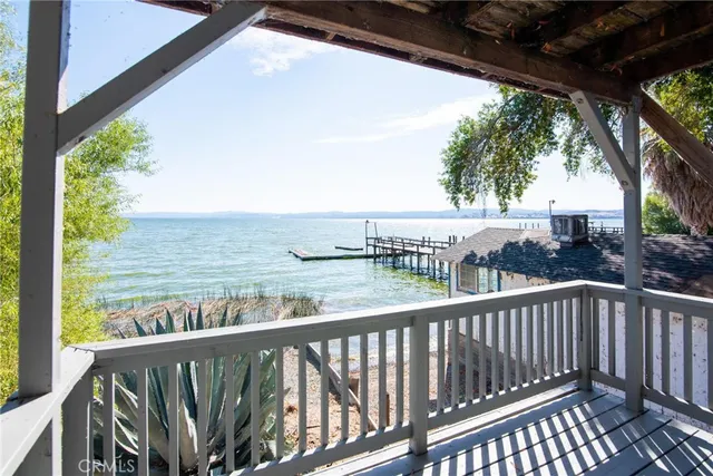 a view of a porch with wooden floor