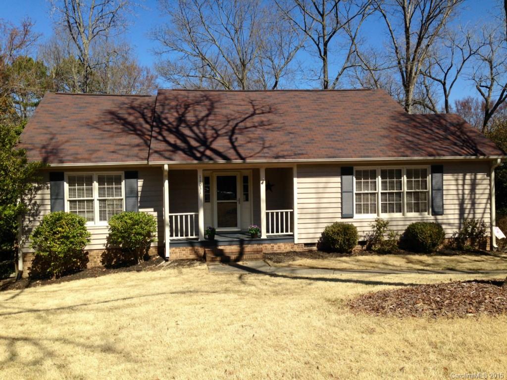 a front view of a house with swimming pool and glass windows