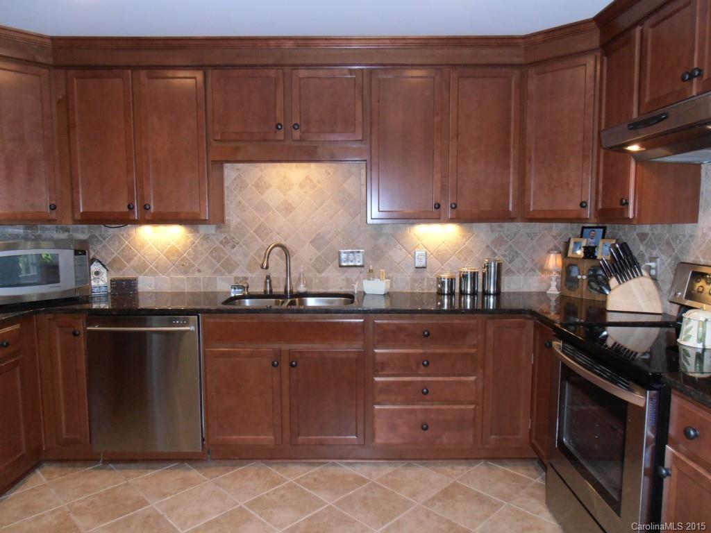 11031 Painted Tree Road Charlotte, NC 28226 - Photo 2 of 15 a kitchen with a sink and cabinets