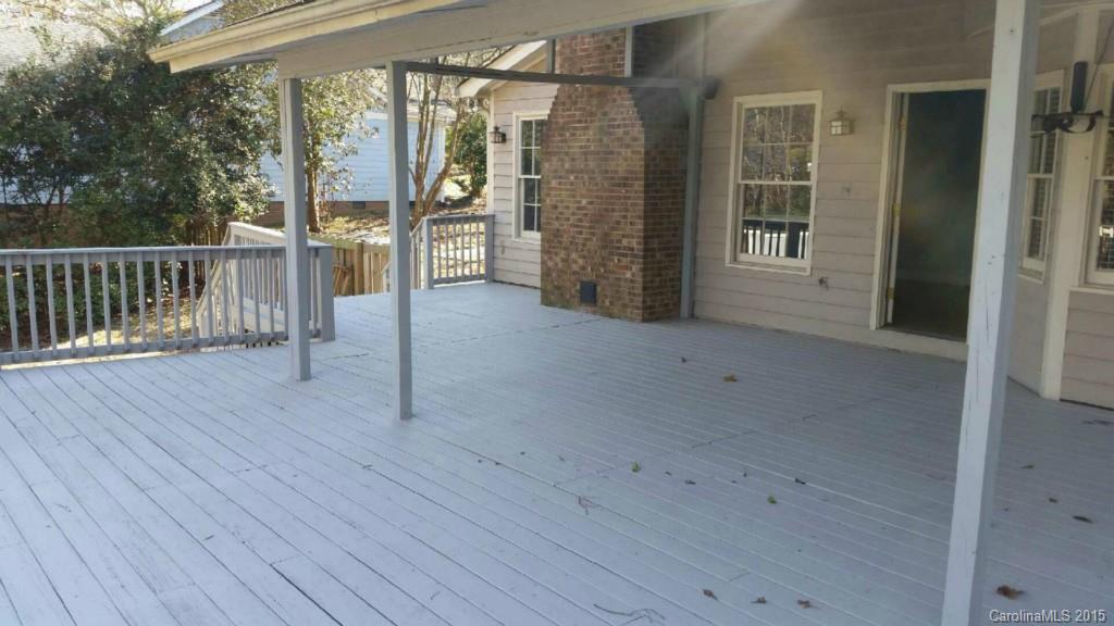 11031 Painted Tree Road Charlotte, NC 28226 - Photo 12 of 15 an empty room with wooden floor and windows